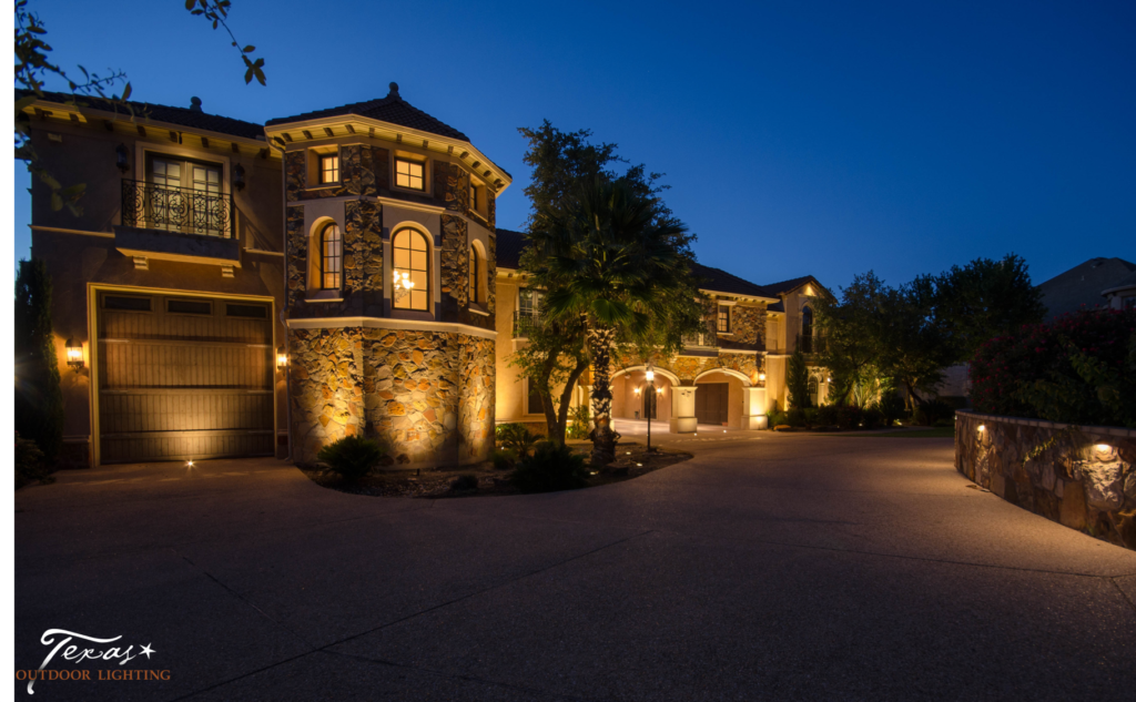 Up lights highlight the stone exterior on a home in Austin Texas